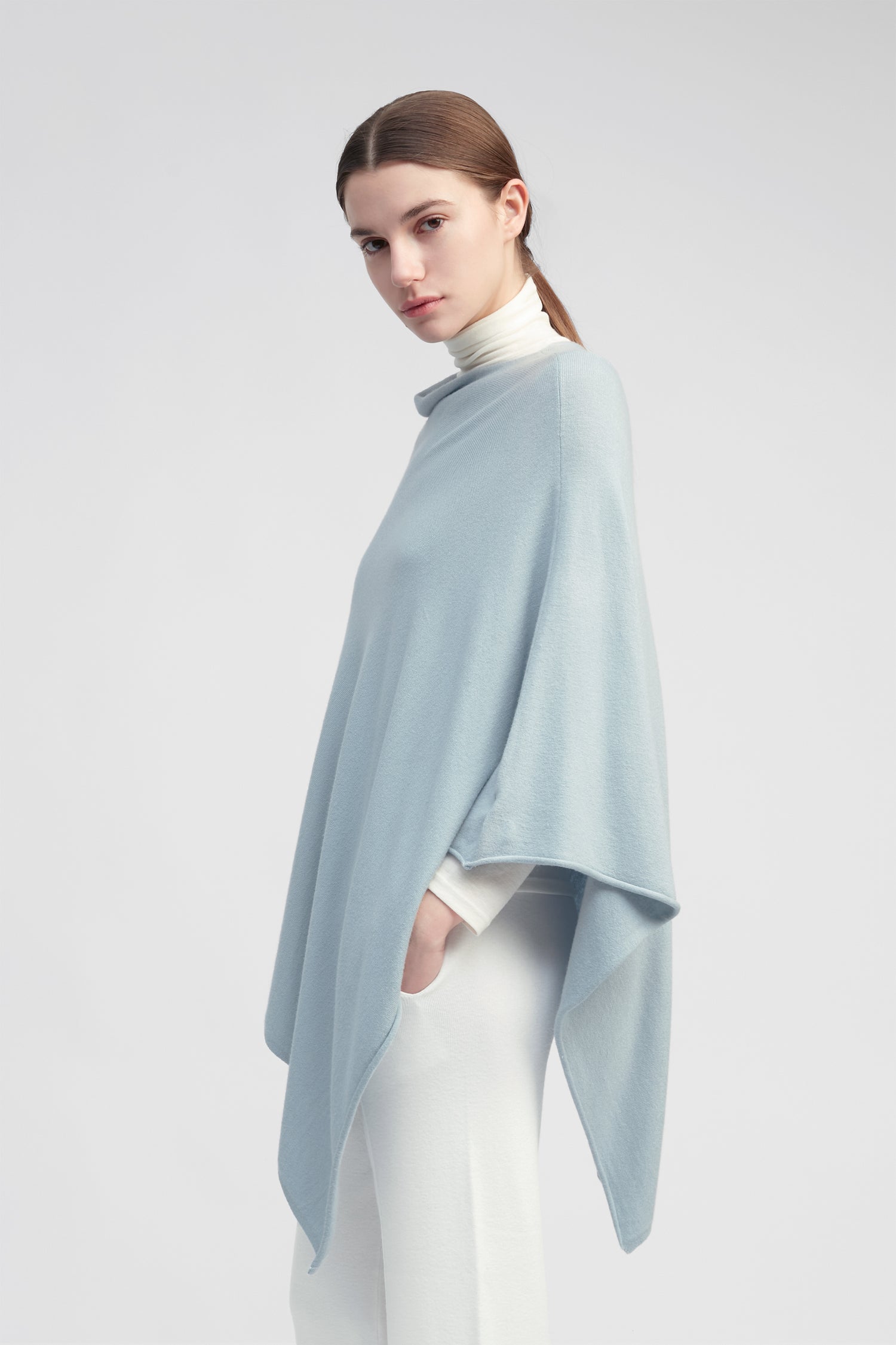 Light blue lightweight triangle poncho with fluid drape for effortless year-round layering – Common Knit