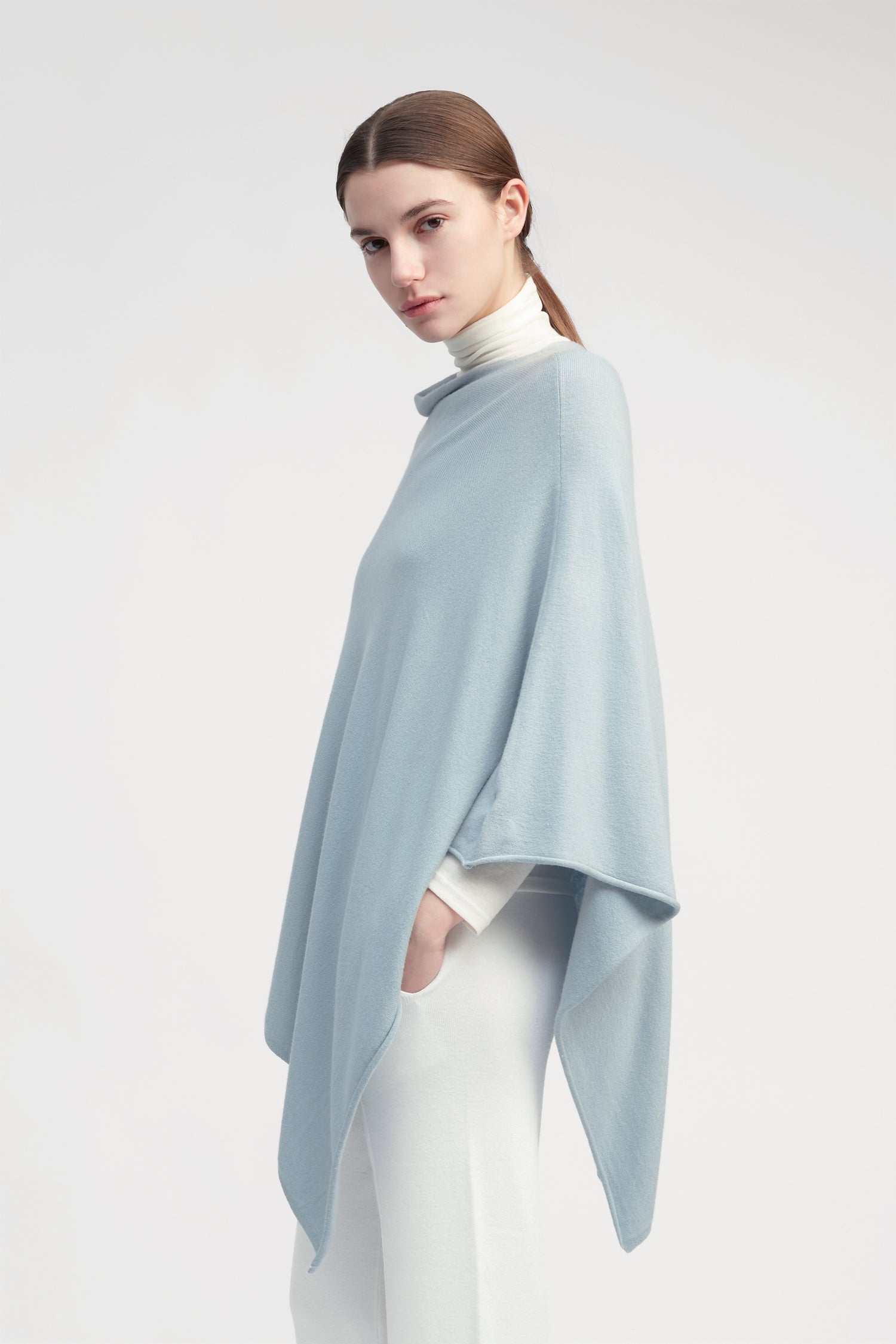 Light blue lightweight triangle poncho with fluid drape for effortless year-round layering – Common Knit