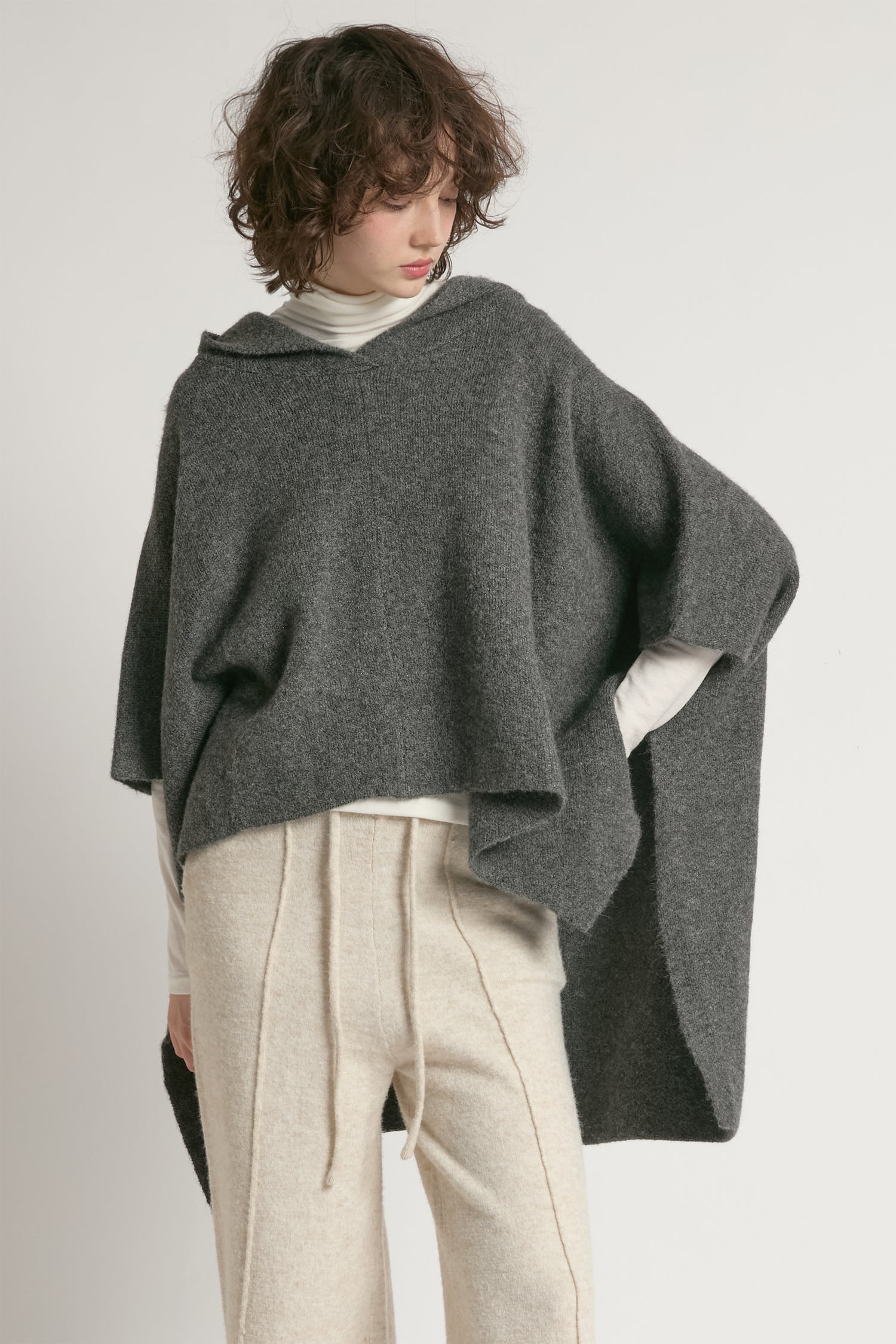 Charcoal hooded pullover poncho with asymmetrical hem and relaxed fit – Common Knit