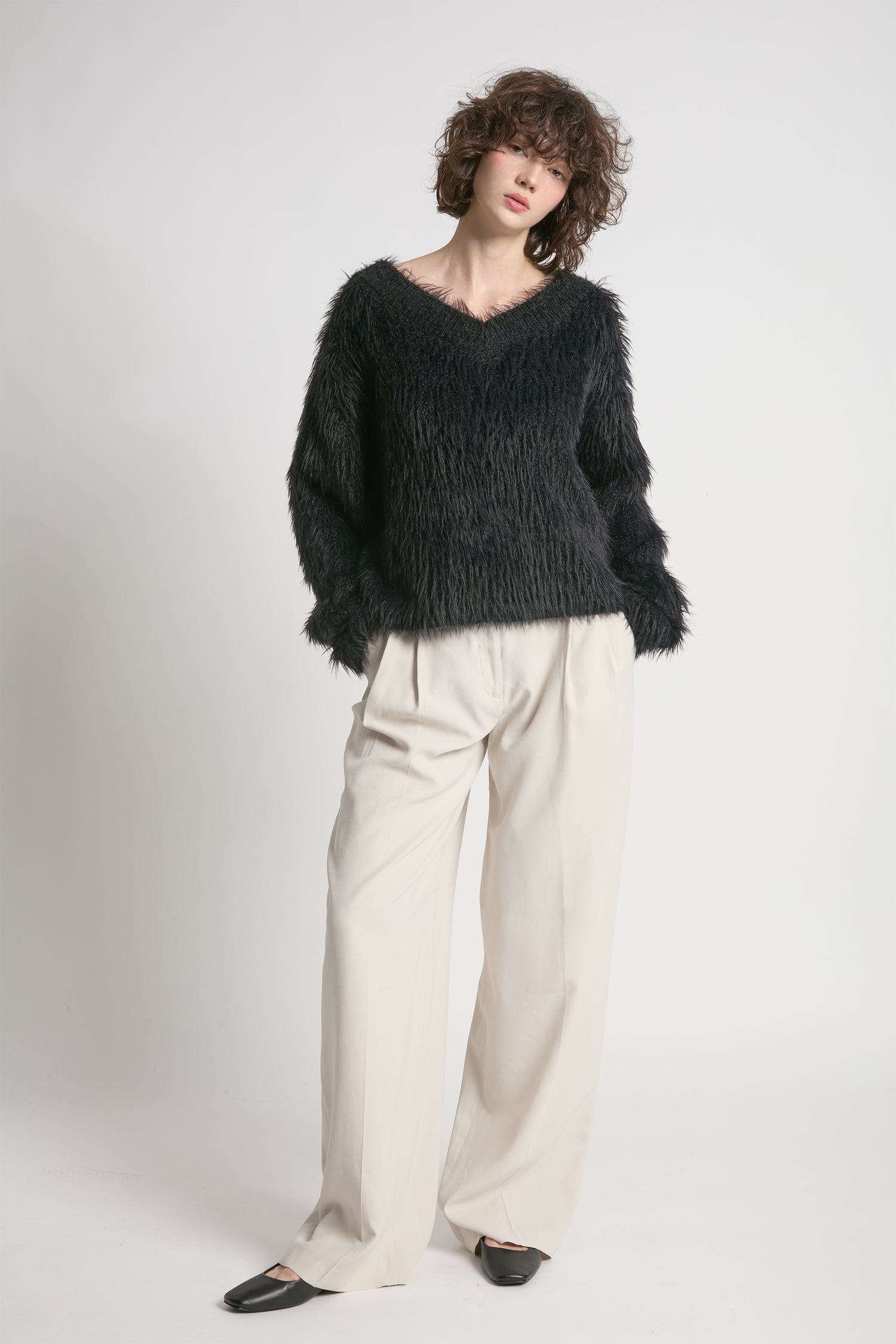 Black oversized fuzzy eyelash sweater with soft V-neck silhouette – Common Knit