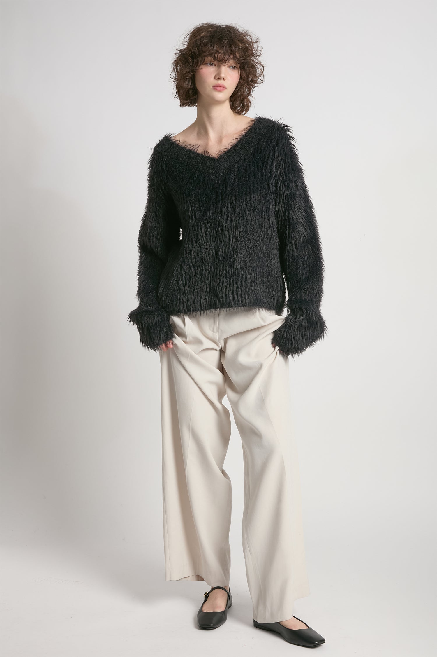 Black oversized fuzzy eyelash sweater with soft V-neck silhouette – Common Knit
