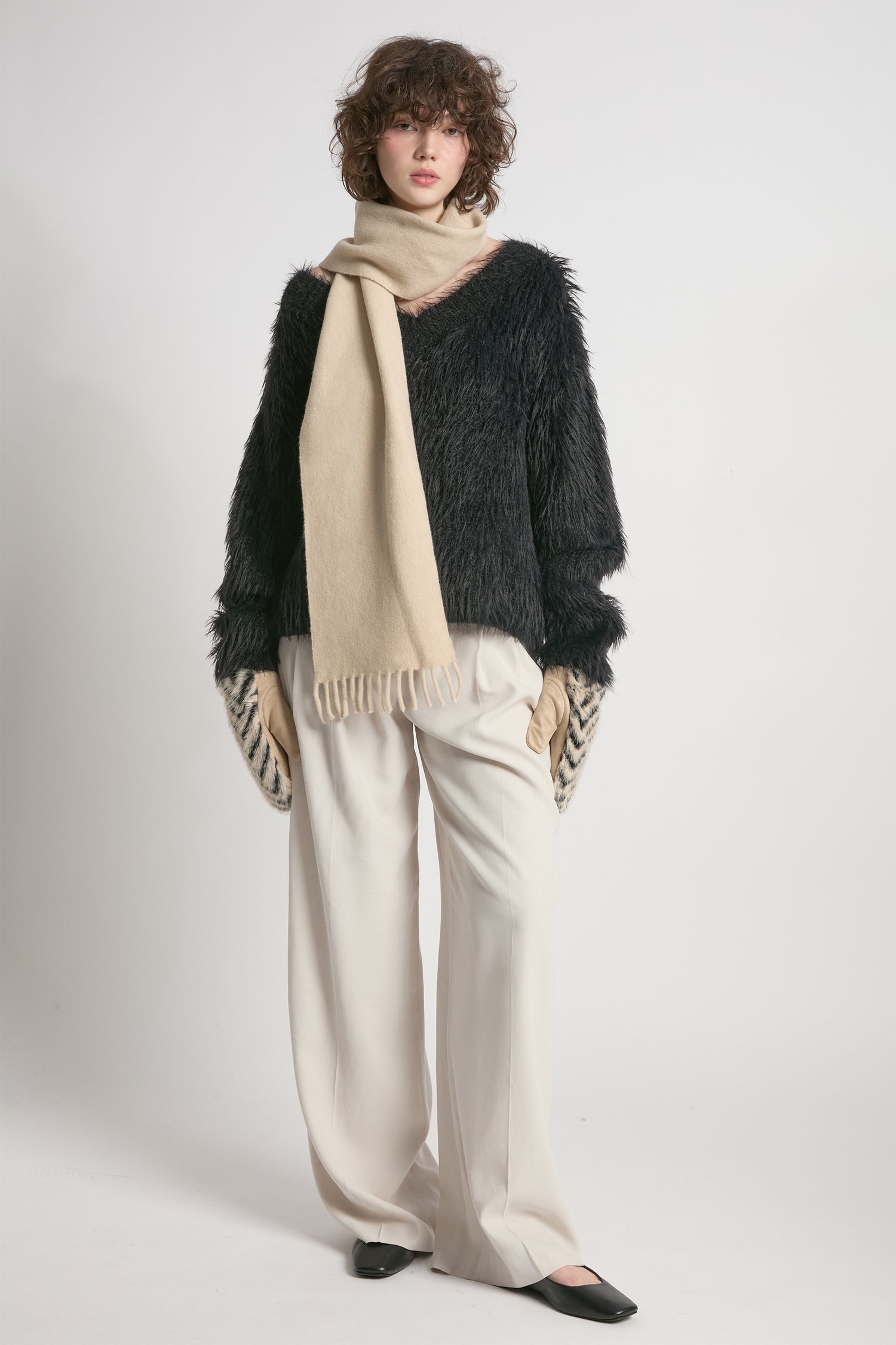 Black oversized fuzzy eyelash sweater with soft V-neck silhouette – Common Knit