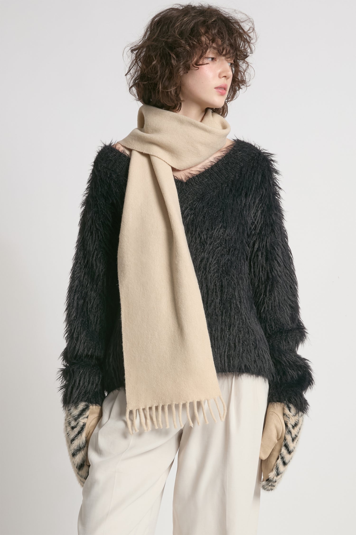 Black oversized fuzzy eyelash sweater with soft V-neck silhouette – Common Knit