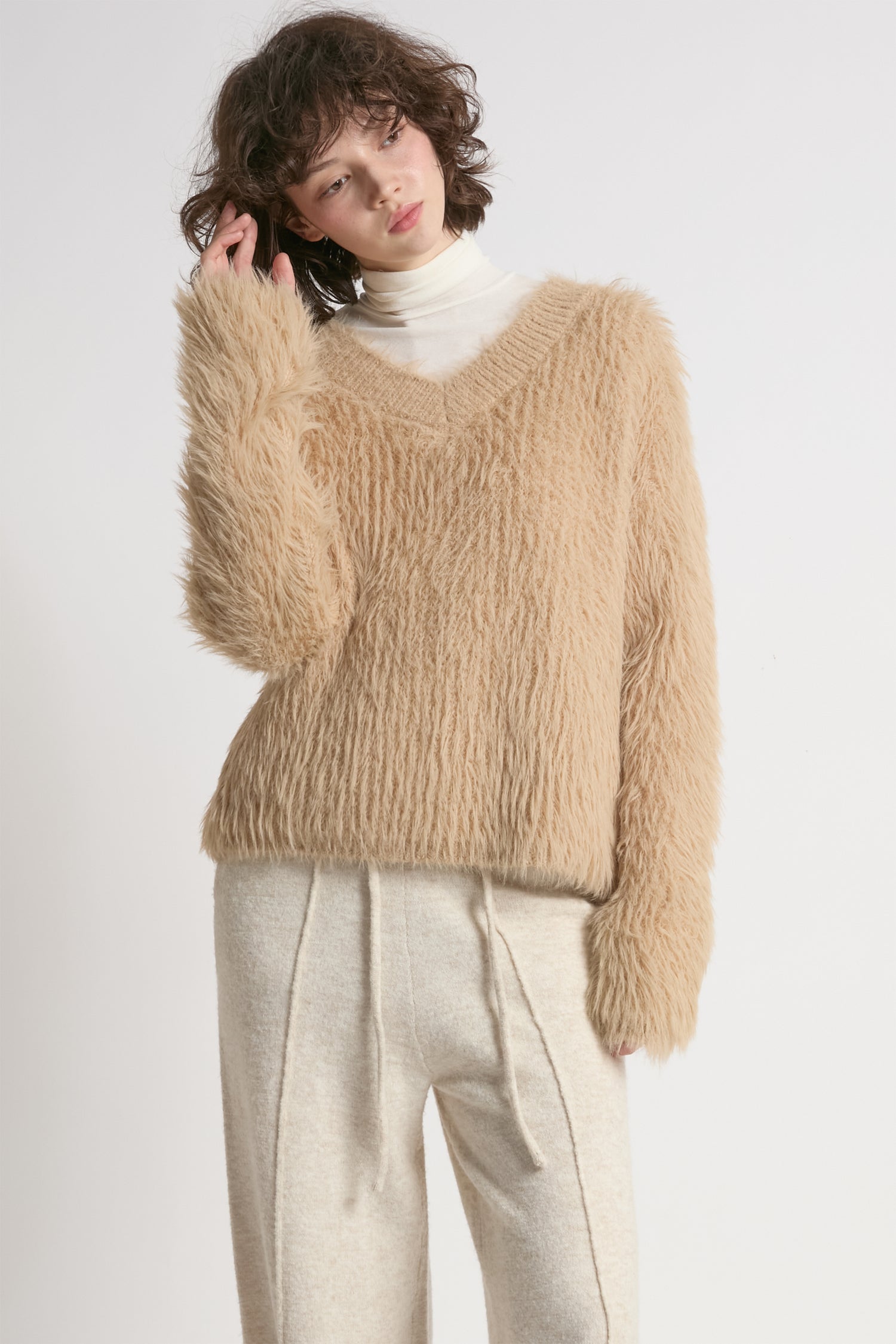 Tan oversized fuzzy eyelash sweater with soft V-neck silhouette – Common Knit