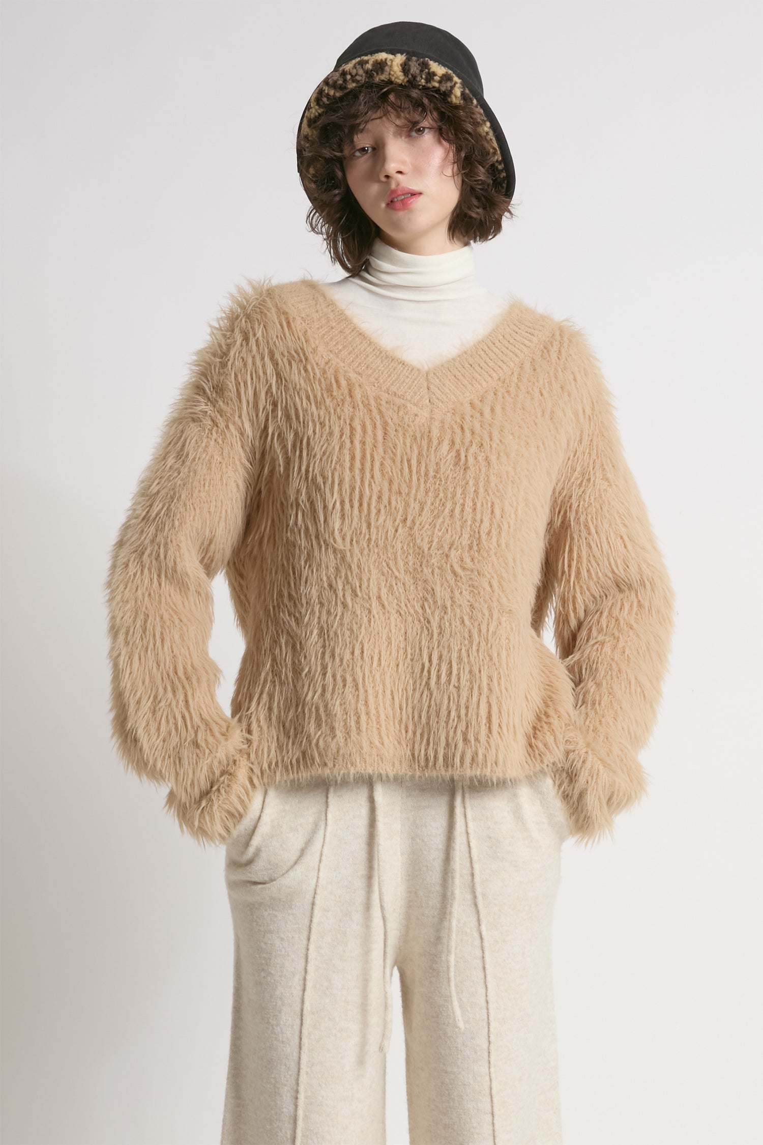 Tan oversized fuzzy eyelash sweater with soft V-neck silhouette – Common Knit