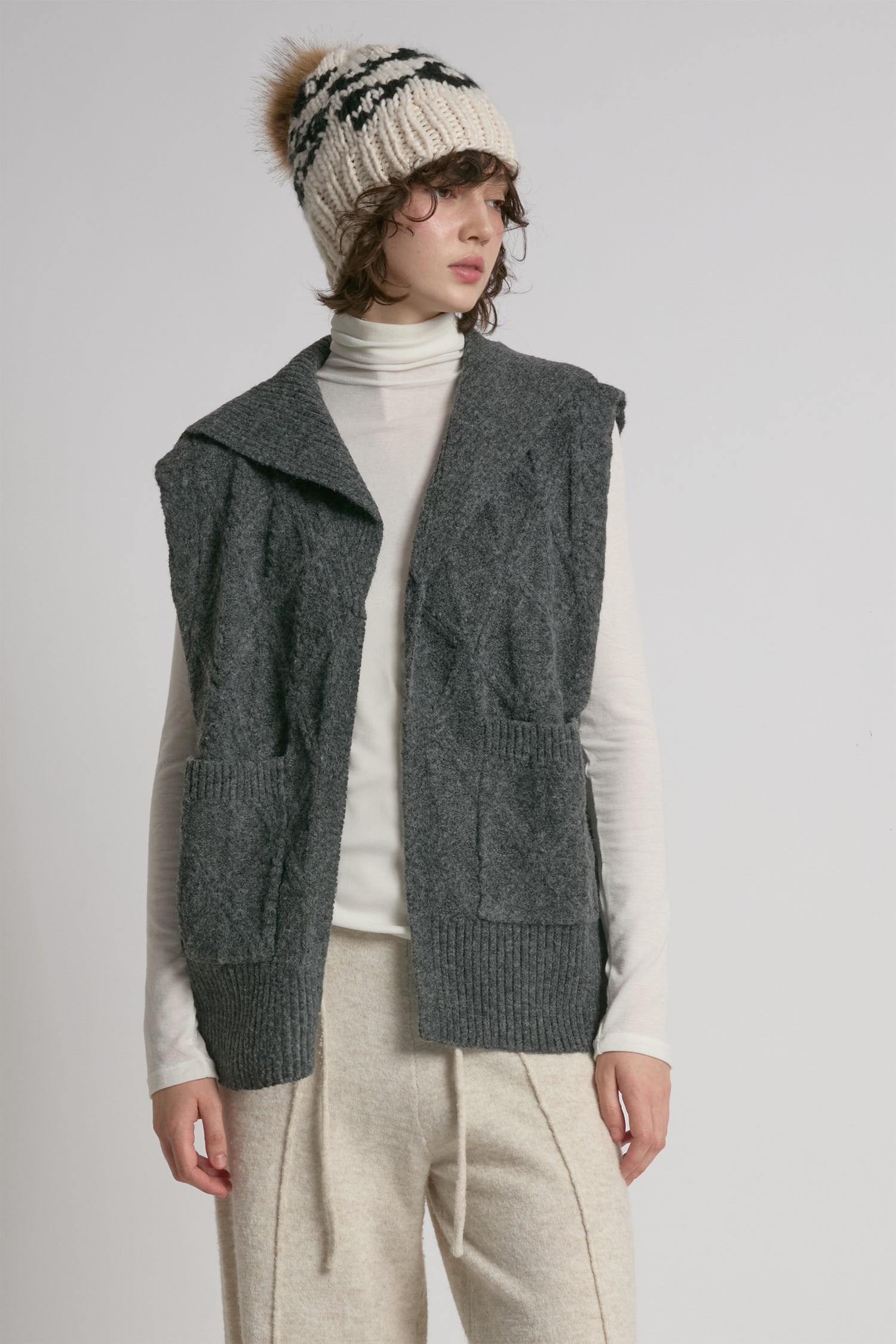 Charcoal cable knit open vest with relaxed fit for textured layering – Common Knit