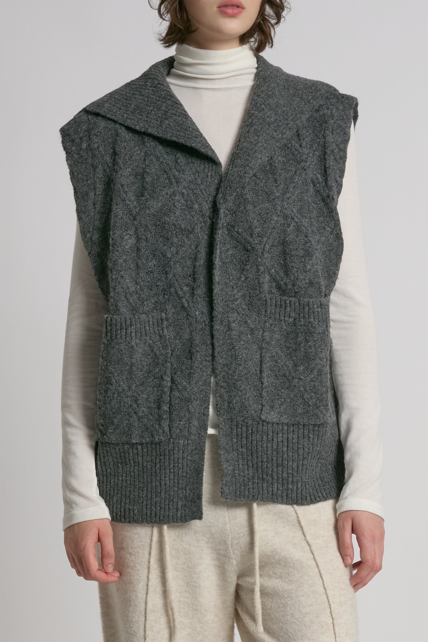 Charcoal cable knit open vest with relaxed fit for textured layering – Common Knit