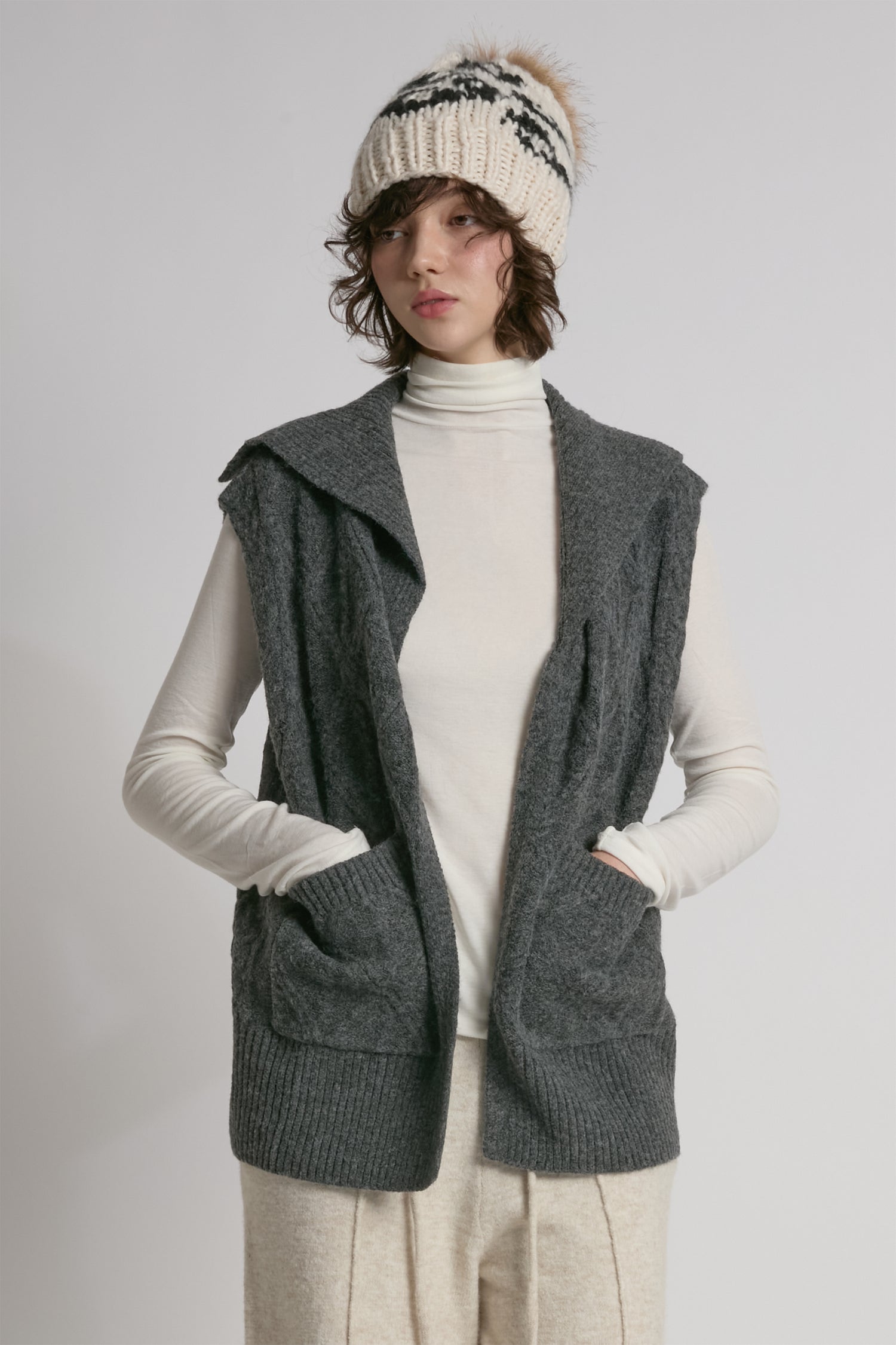 Charcoal cable knit open vest with relaxed fit for textured layering – Common Knit